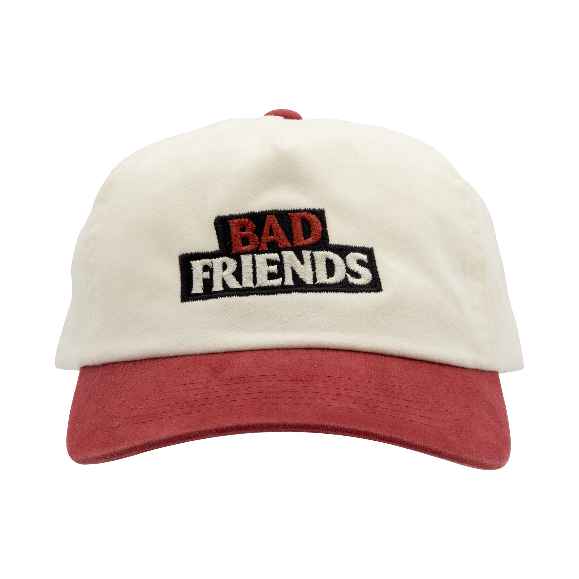 White cap with red brim and 'BAD FRIENDS' text on a white background