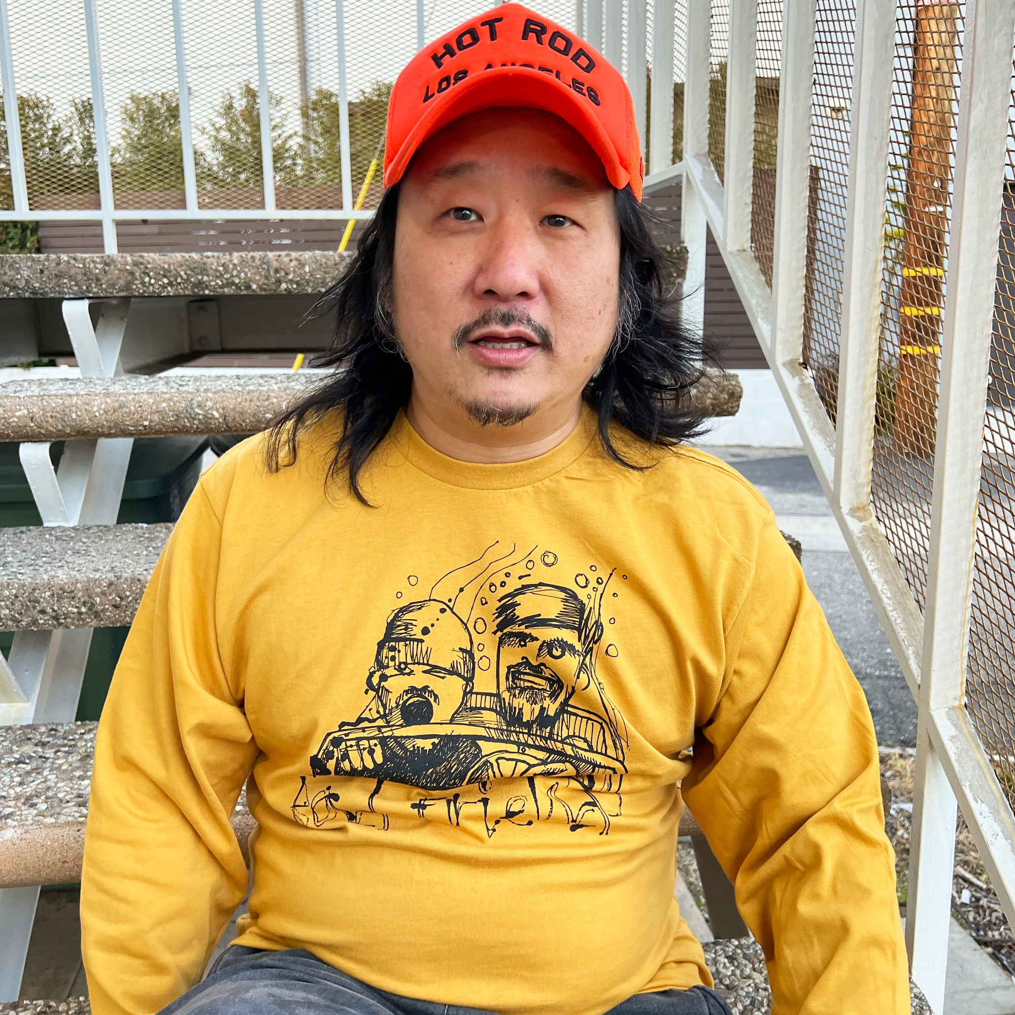 Bobby lee wearing yellow Long sleeve tee with sketch Fear & Loathing Bad friends logo
